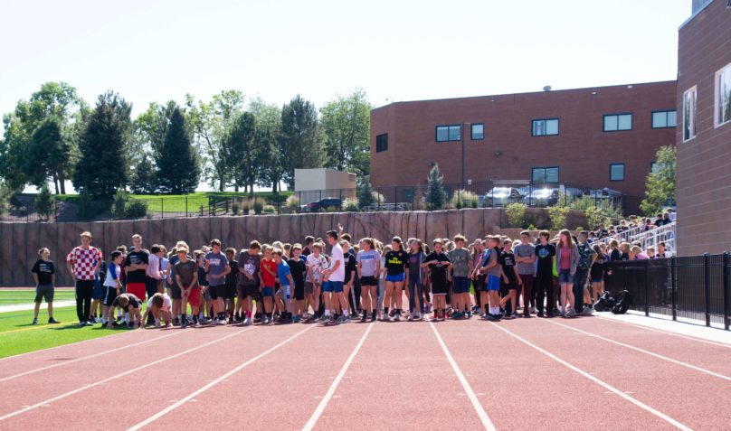 line up of kids before a race on the track