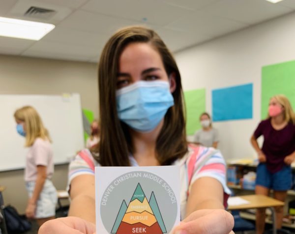 student showing off sticker