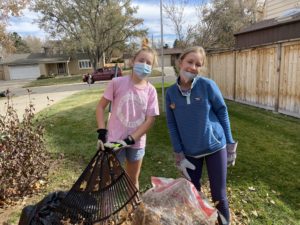Two girls doing yardwork